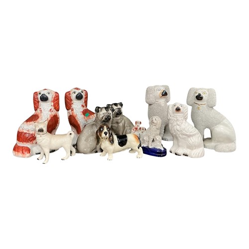 Lot 36 - Various Staffordshire models of dogs, 19th...