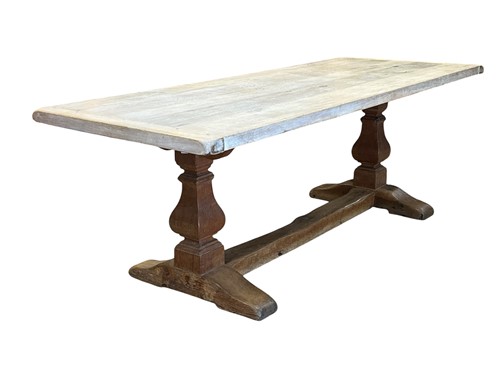 Lot 677 - A 17th century style oak dining table, modern,...
