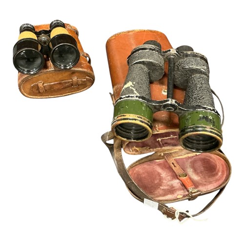 Lot 101 - Two pairs of wartime binoculars, one pair...