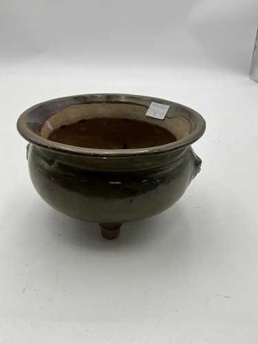 Lot 111 - A Chinese tea dust glazed tripod censer, Qing...