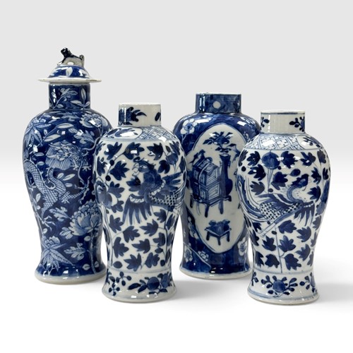 Lot 38 - A pair of Chinese blue and white porcelain small phoenix vases, Qing Dynasty, late 19th century
