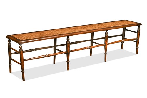 Lot 682 - A long caned rectangular stool, 19th century