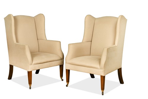 Lot 474 - A pair of wingback armchairs by Balmain & Balmain