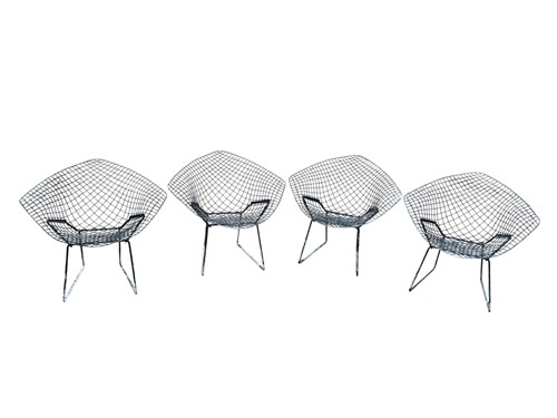 Lot 676 - A set of four Diamond chairs designed by Harry...