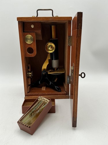 Lot 103 - A lacquered brass and black finished monocular...
