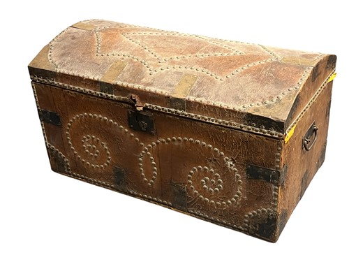 Lot 721 - A domed top studded leather travelling trunk...