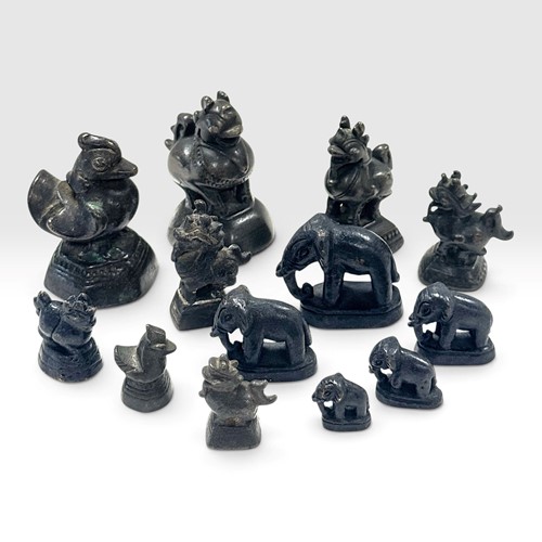Lot 73 - A group of thirteen opium weights, 19th century