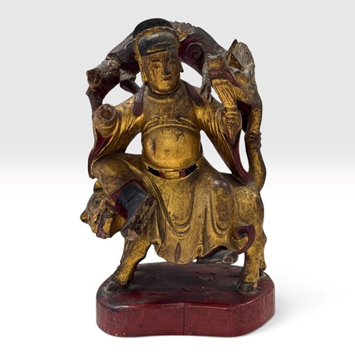 Lot 59 - A Chinese carved wooden and gilt figure of a deity, 18th century