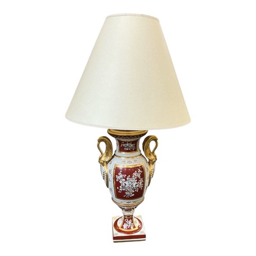 Lot 82 - A French parcel gilt porcelain table lamp,...