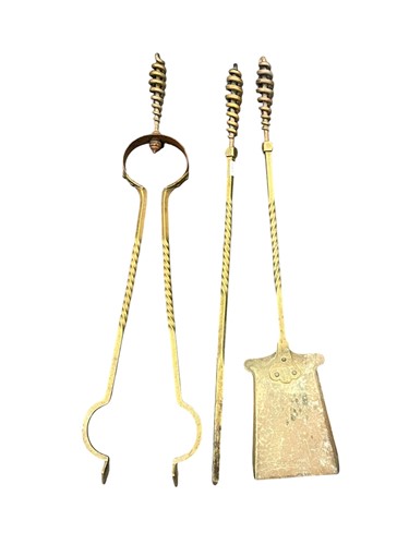 Lot 696 - A set of three brass fire tools, 20th century,...