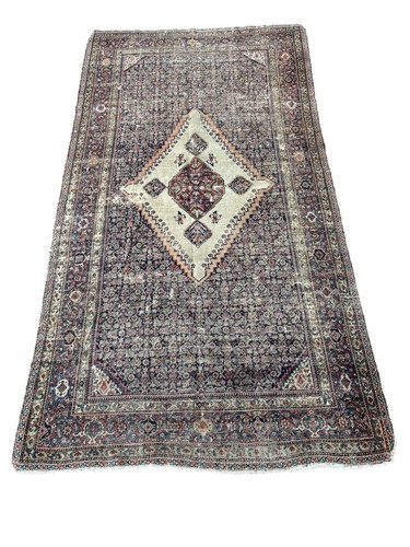 Lot 805 - A Persian rug, the central medallion on a...