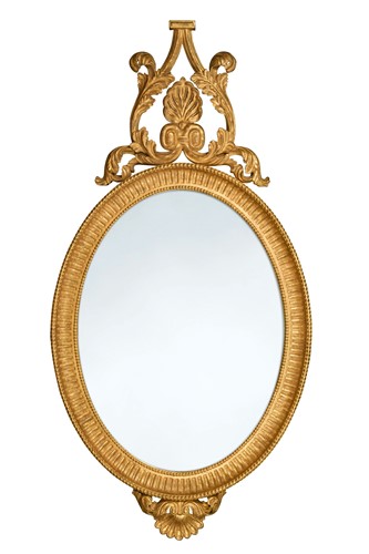 Lot 434 - A George III style carved giltwood wall mirror