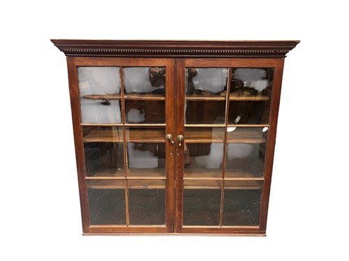 Lot 645 - A mahogany bookcase, 19th century, dentil...