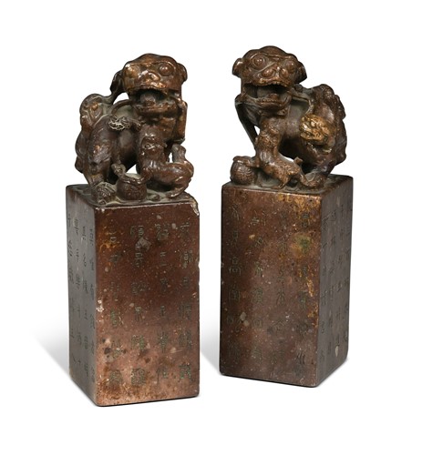 Lot 54 - A pair of carved soapstone Foo dogs seals, late 19th / early 20th century