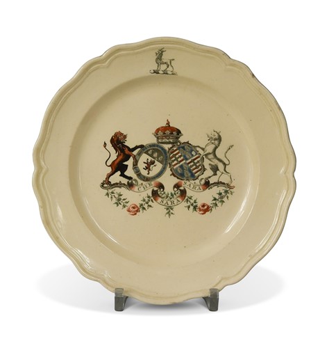 Lot 387 - A rare creamware armorial plate, 18th century