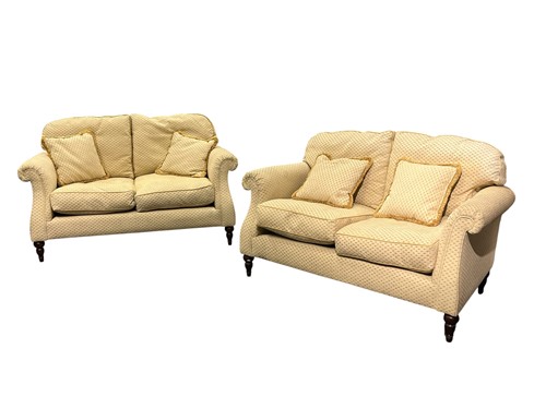 Lot 735 - A pair of modern two seat sofas, on turned...