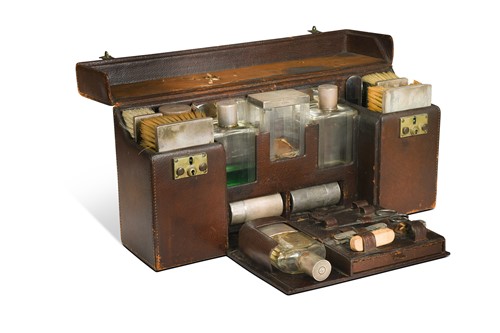 Lot 476 - A fitted vanity case with silver-mounted contents