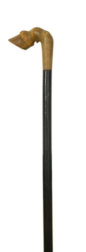 Lot 701 - An ebonised walking cane with rhinoceros horn handle, late 19th or early 20th century