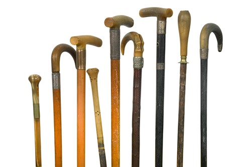 Lot 705 - A collection of nine assorted horn-handled walking sticks