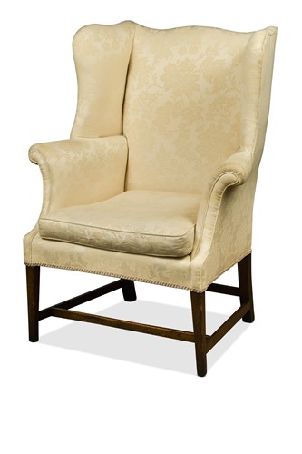 Lot 410 - A George III mahogany wingback armchair